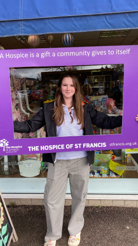 A young volunteer from Marshalswick Owned, The Hospice of St Francis charity shop in St Albans.