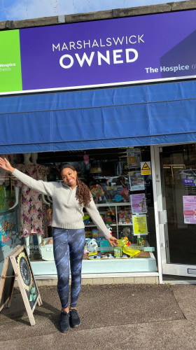 A young volunteer from Marshalswick Owned, The Hospice of St Francis charity shop in St Albans.