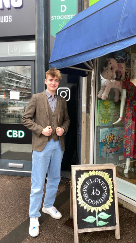 A young volunteer from Marshalswick Owned, The Hospice of St Francis charity shop in St Albans.