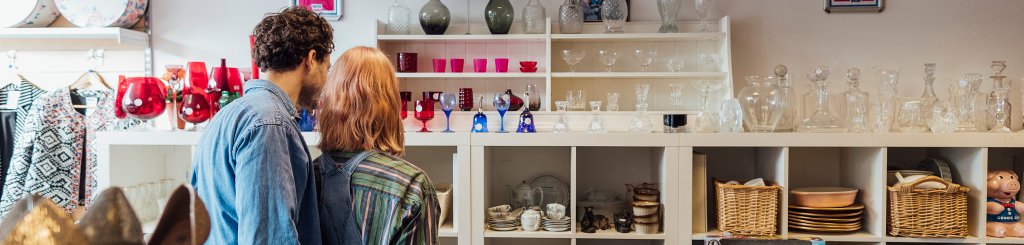 Customers browsing in a charity shop.