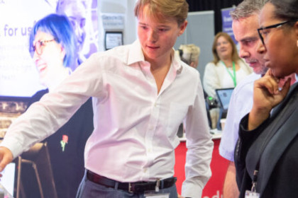 Exhibitor with clients at Conference