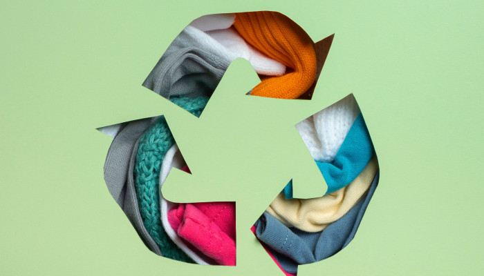 Reuse symbol made of clothes