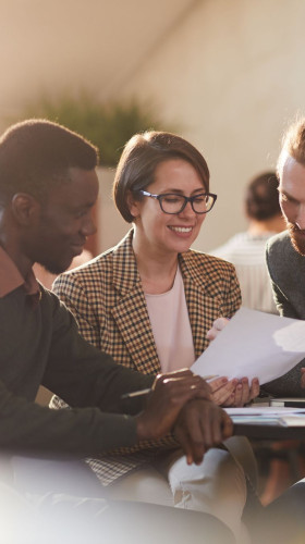 Three people in a strategy session