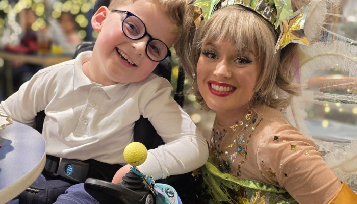 Acorns Children's Hospice service user with Christmas fairy at Selfridges