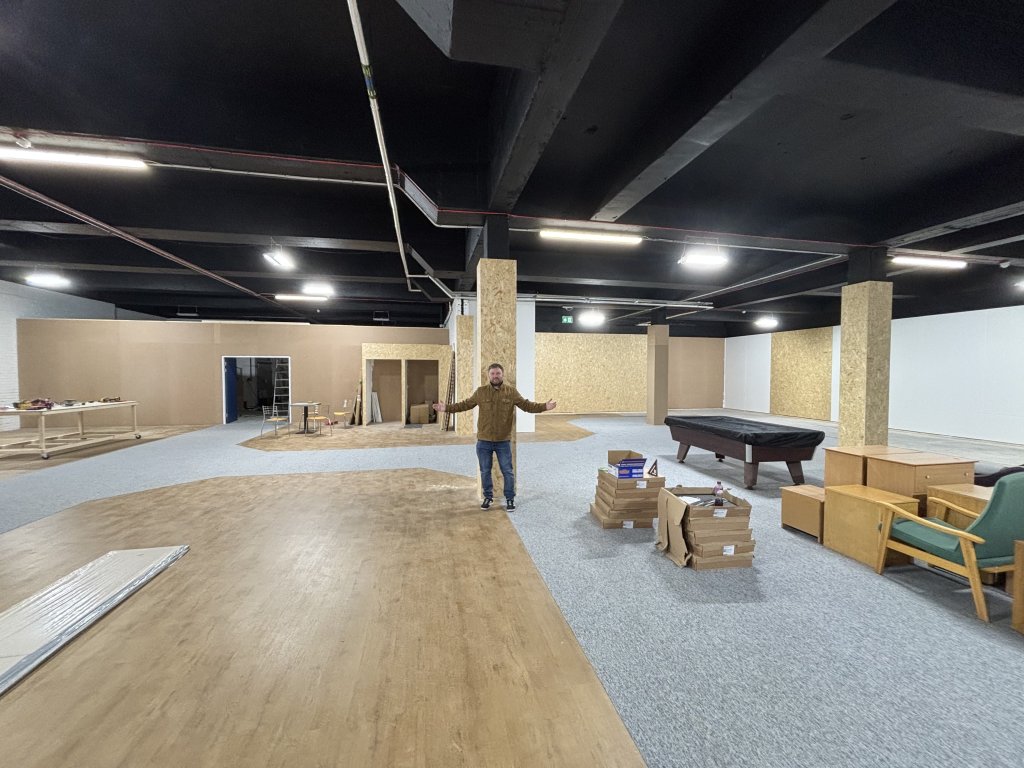 Birmingham Hospice Simon Mitchell inside large property ready to be furbished.