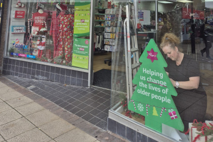 Window dresser preparing a festive window display