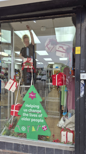 Window dresser preparing a festive window display