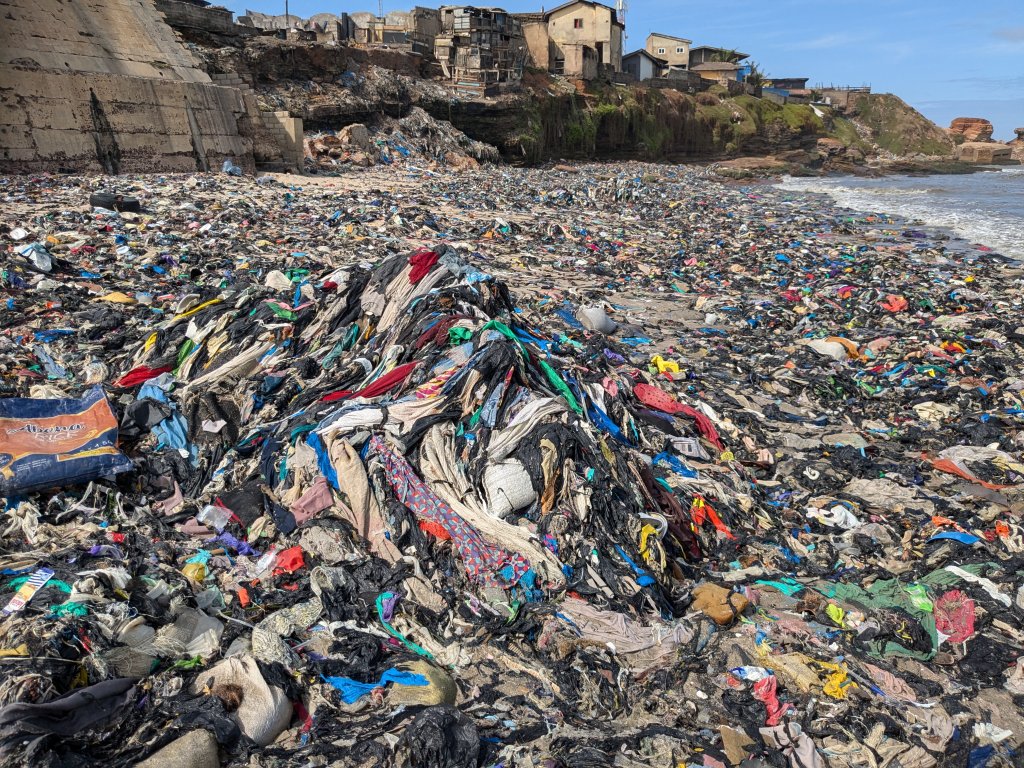 Textile waste covering beach in Jamestown.