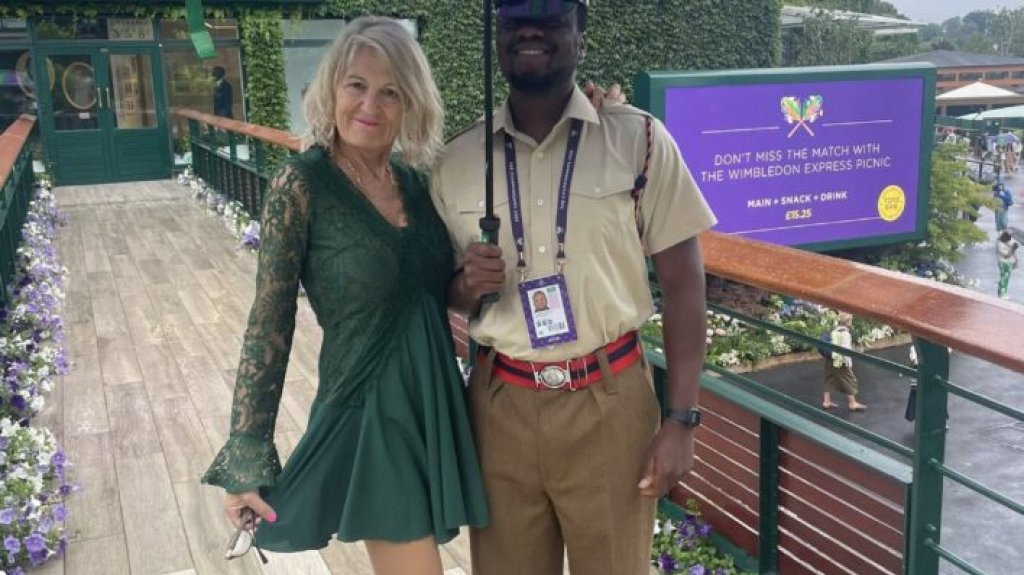 A couple pose at Wimbledon.