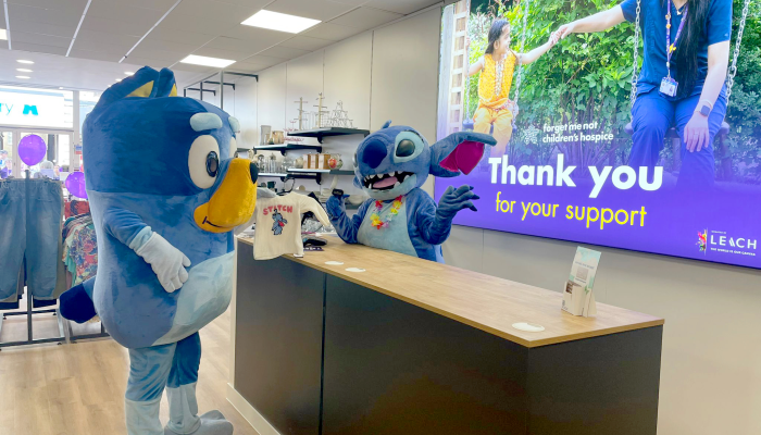 Characters Bluey and Stitch at till