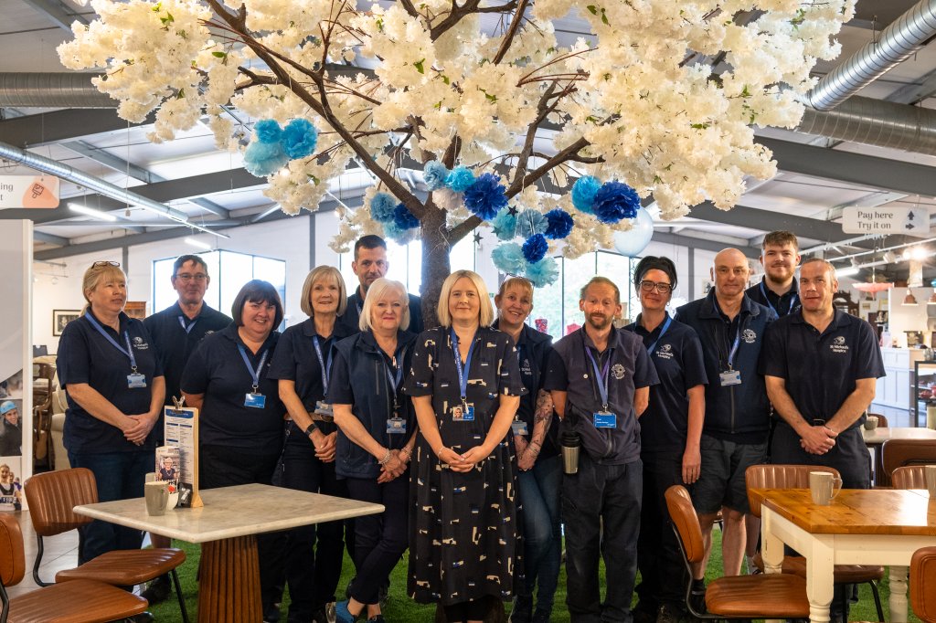 Team members pictured in charity store.
