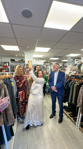 Award presentation taking place in shop